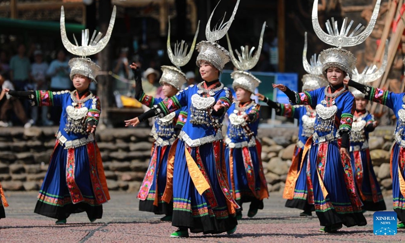 Villagers in traditional costumes perform at Leishan County of Qiandongnan Miao and Dong Autonomous Prefecture, southwest China's Guizhou Province, Sept. 26, 2026. Chinese people are on a three-day holiday for the Mid-Autumn Festival, which fell on Sept. 25 this year. (Photo by Wu Xianyan/Xinhua)