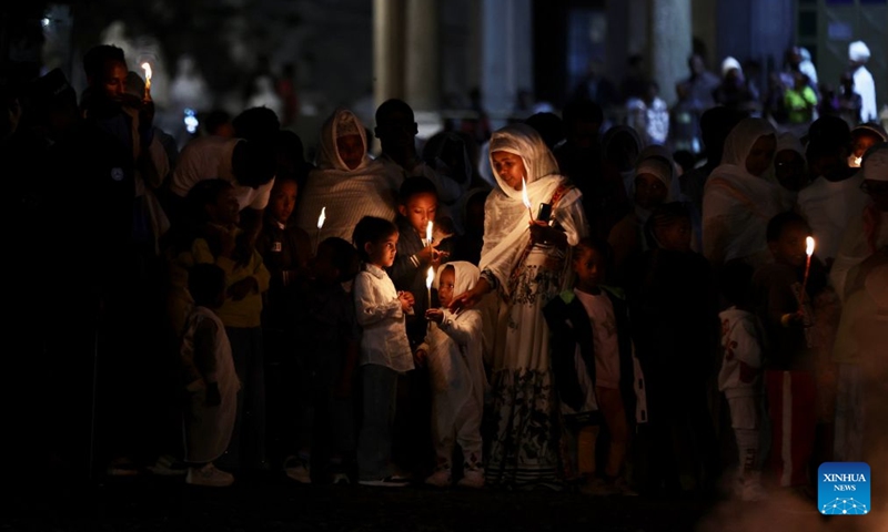 People burn candles to celebrate the Meskel festival in Addis Ababa, capital of Ethiopia, Sept. 26, 2026. Meskel is a major religious festival in Ethiopia that includes the burning of a large bonfire, known as Demera. (Xinhua/Geng Xinning)