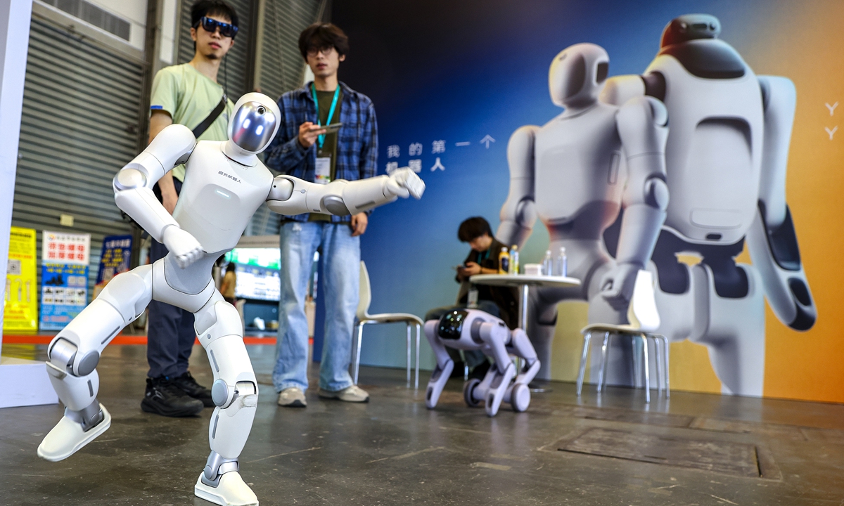 Visitors observe a humanoid robot on display at the Shanghai International Intelligent Home Expo in Shanghai on September 28, 2026. The expo features kitchen and bathroom homeware, home appliances, and smart elderly care, smart home and green technologies. Photo: VCG