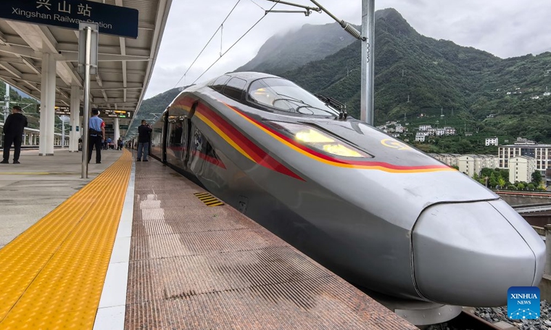 The first train of Yichang-Xingshan high-speed railway, G6888, is pictured ahead of its departure from Xingshan Railway Station in Xingshan County, central China's Hubei Province, Sept. 28, 2026. The 101-kilometer Yichang-Xingshan high-speed railway officially entered service on Monday. The railway, with a designed speed of 350 kilometers per hour, is an important part of the country's high-speed rail network. (Xinhua/Wang Zichen)