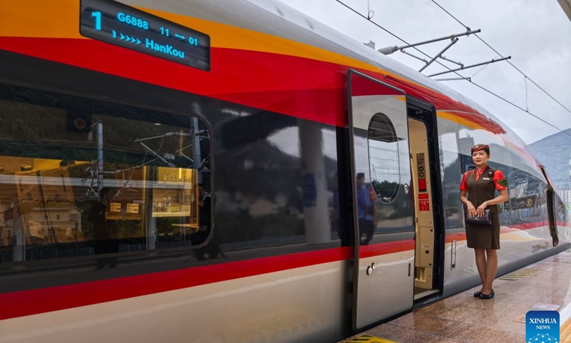 The first train of Yichang-Xingshan high-speed railway, G6888, is pictured ahead of its departure from Xingshan Railway Station in Xingshan County, central China's Hubei Province, Sept. 28, 2026. The 101-kilometer Yichang-Xingshan high-speed railway officially entered service on Monday. The railway, with a designed speed of 350 kilometers per hour, is an important part of the country's high-speed rail network. (Xinhua/Wang Zichen)