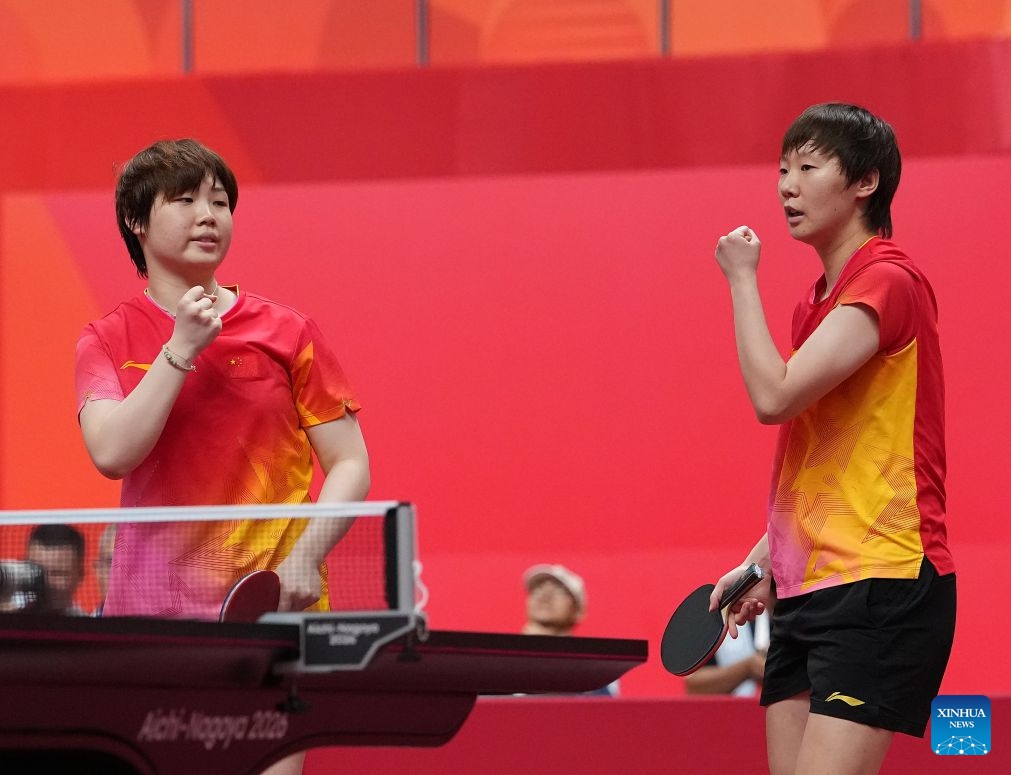 Kuai Man (L)/Wang Manyu of China celebrate during the women's doubles semifinals of table tennis against Suthasini Sawettabut/Orawan Paranang of Thailand at the 20th Asian Games Aichi-Nagoya 2026 in Toyota of Aichi Prefecture, Japan, Sept. 28, 2026. (Xinhua/Cheong Kam Ka)

