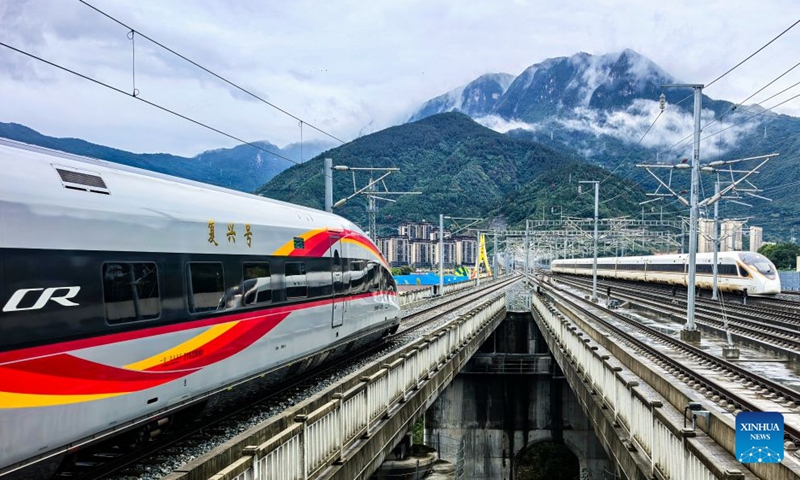 The first train of Yichang-Xingshan high-speed railway, G6888, departs from Xingshan Railway Station in Xingshan County, central China's Hubei Province, Sept. 28, 2026. The 101-kilometer Yichang-Xingshan high-speed railway officially entered service on Monday. The railway, with a designed speed of 350 kilometers per hour, is an important part of the country's high-speed rail network. (Photo by Zou Yuanjing/Xinhua)