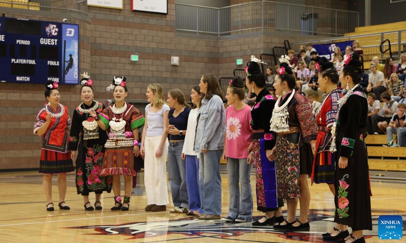 Members of Auntie Basketball interact with American students at Crimson Cliffs High School in Washington, Utah, the United States, Oct. 2, 2026.(Photo by Zeng Hui/Xinhua)