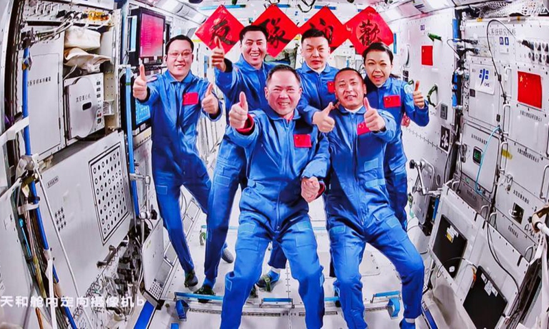 This image captured at Beijing Aerospace Control Center on May 25, 2026 shows a group picture of the crew of Shenzhou-21 and Shenzhou-23 spaceships. (Xinhua/Jin Liwang)