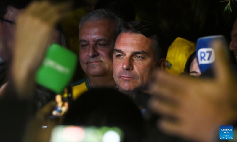 Flavio Bolsonaro (C), presidential candidate of Brazil's Liberal Party, is seen after the announcement of the first-round results of the presidential election in Brasilia, Brazil, Oct. 4, 2026. (Xinhua/Lucio Tavora)