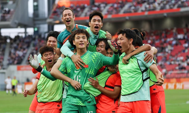 Players of China celebrate after winning the men's 3rd place match of Football between China and Uzbekistan at 20th Asian Games Aichi-Nagoya 2026 in Toyota of Aichi Prefecture, Japan, Oct. 3, 2026. Photo: Xinhua
