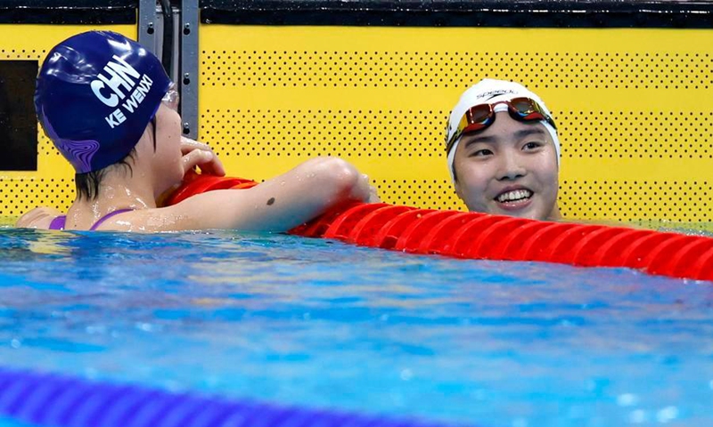 Yu Zidi (R) and Ke Wenxi of China react after the women's 400m individual medley final at the 20th Asian Games Aichi-Nagoya 2026 in Tokyo, Japan, Sept. 23, 2026. Photo: Xinhua
