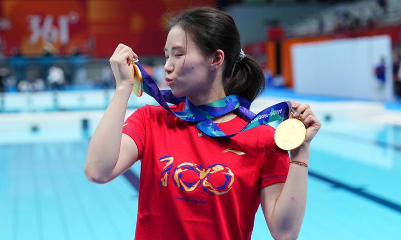 Chen Yuxi of China, gold medalist of the women's 10m platform and women's synchronised 10m platform, poses for photos after diving competition at the 20th Asian Games Aichi-Nagoya 2026 in Tokyo, Japan, Sept. 30, 2026. Photo: Xinhua
