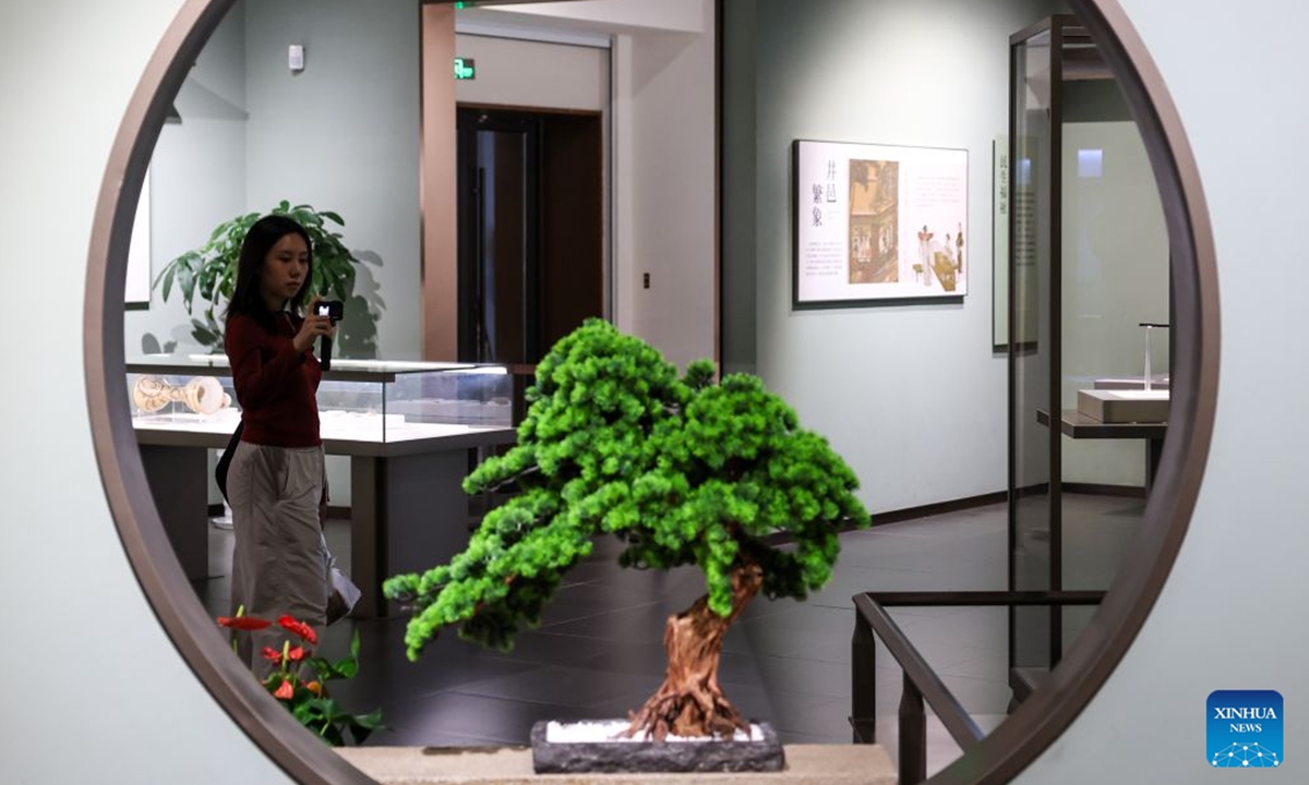 A woman visits the Southern Song Dynasty Deshou Palace Ruins Museum in Hangzhou, east China's Zhejiang Province, Oct. 6, 2026. During the National Day holiday, tourists across the country visited the museum to appreciate cultural attractions. (Xinhua/Jiang Han)