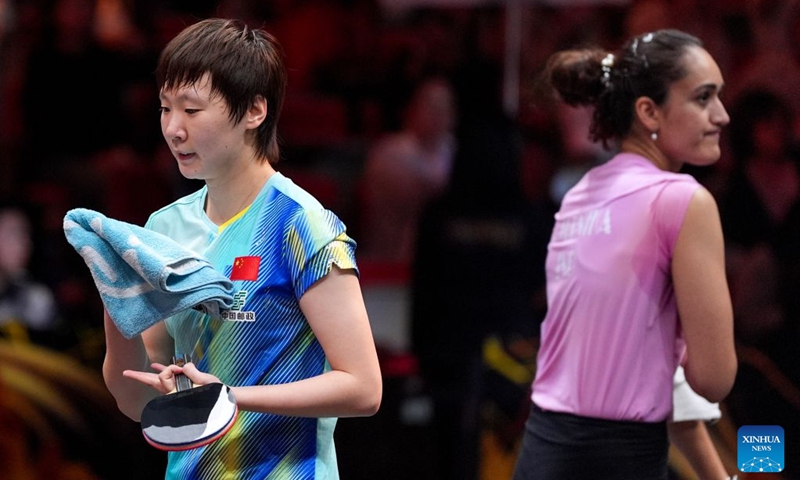 Wang Manyu (L) of China reacts after winning the women's singles round of 32 match against Manika Batra of India at 2025 World Table Tennis (WTT) China Smash in Beijing, China, Oct. 6, 2026. Photo: Xinhua