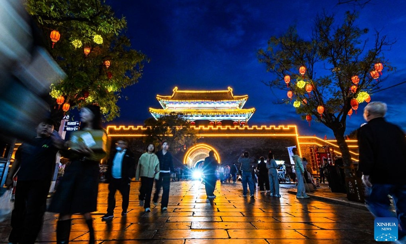 People visit a scenic spot in Shangqiu, central China's Henan Province, Oct. 4, 2026. During the National Day holiday, night tours were launched across China to create diversified consumption scenes. Photo: Xinhua