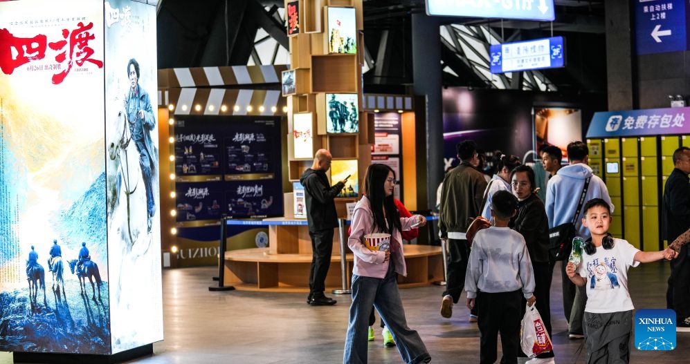 Spectators walk into a cinema in Yunyan District, Guiyang City of southwest China's Guizhou Province, Oct. 6, 2026. During the National Day holiday, people go to cinemas to watch movies across China. (Xinhua/Tao Liang)