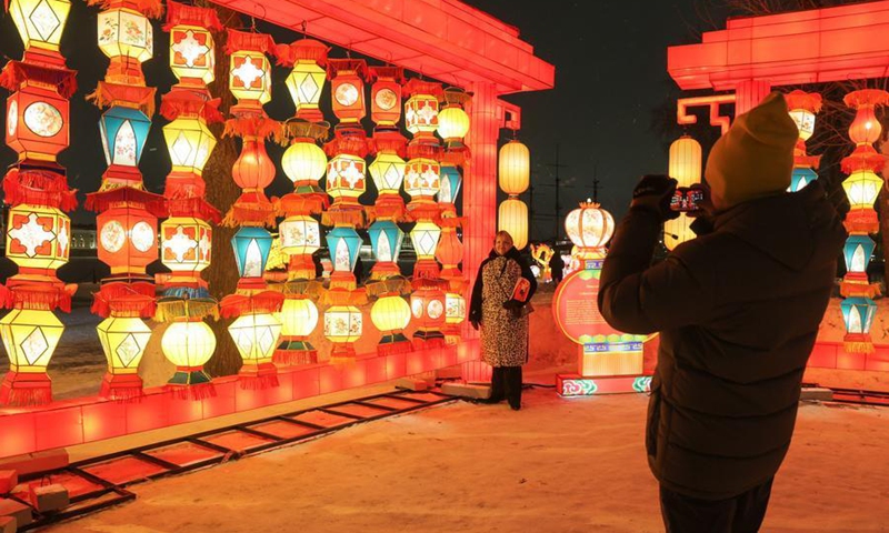A tourist takes photos of lanterns in St. Petersburg, Russia, Feb. 15, 2026. (Photo by Irina Motina/Xinhua)
