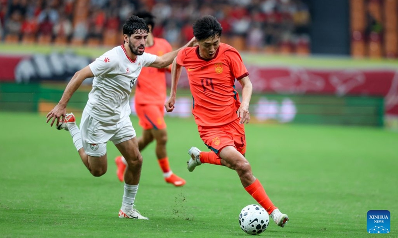 Liu Yang (R) of China vies with Shervoni Mabatshoev of Tajikistan during the CFA Team China International Football Competitions Chongqing 2026 between China and Tajikistan in Chongqing, Oct. 6, 2026. Photo: Xinhua