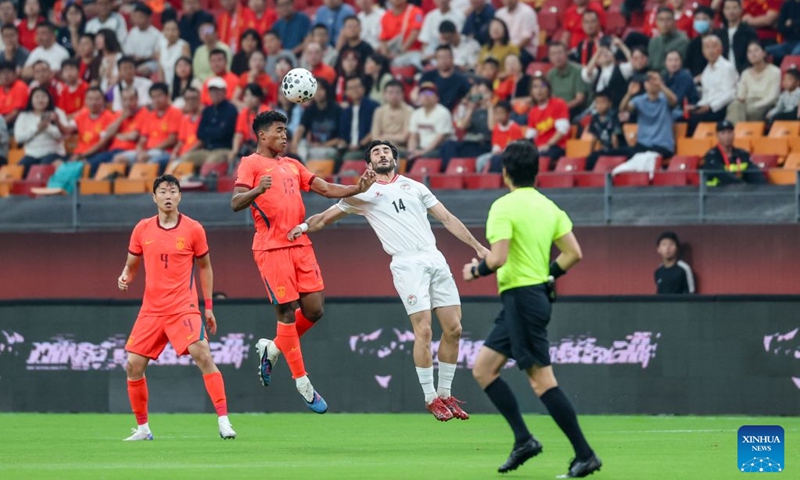 Huang Shenghao (2nd L) of China and Sheriddin Boboev of Tajikistan head for the ball during the CFA Team China International Football Competitions Chongqing 2026 between China and Tajikistan in Chongqing, Oct. 6, 2026. Photo: Xinhua