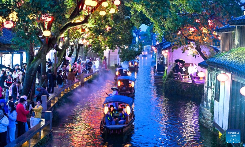 Tourists visit the ancient town of Zhouzhuang, Kunshan City, east China's Jiangsu Province, Oct. 3, 2026. During the National Day holiday, night tours were launched across China to create diversified consumption scenes. Photo: Xinhua