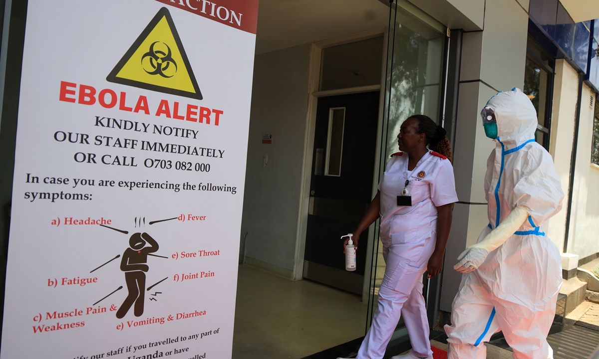 Health worker and official walk outside an Ebola isolation facility at the Nairobi Hospital, Nairobi, Kenya on October 7, 2026. Kenya confirmed its first Ebola case on October 6 after a Kenyan citizen who had traveled from Democratic Republic ?of Congo died in Nairobi, Reuters reported.
Photo: VCG
