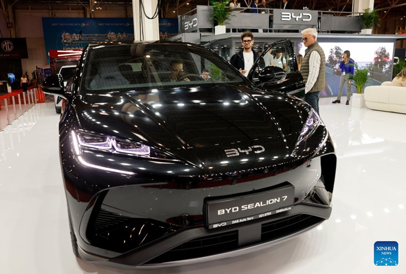 Visitors look at a car model produced by Chinese producer BYD during the first day of Bucharest Auto Show & Accessories in Bucharest, Romania, Oct. 6, 2026. Photo: Xinhua