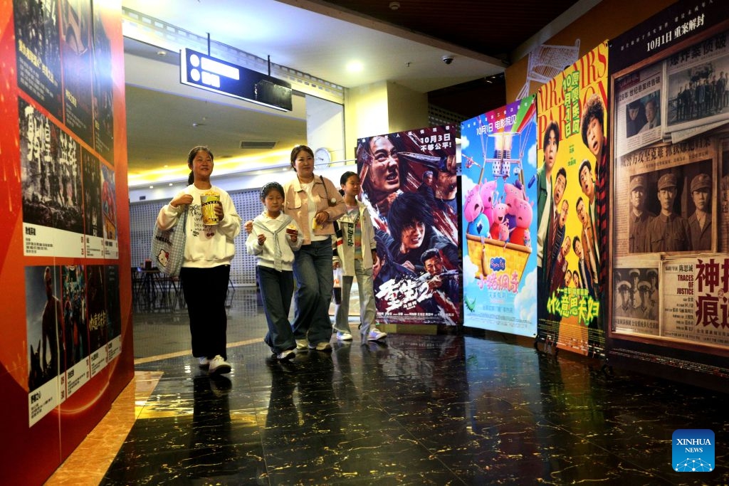 Spectators walk into a cinema in Lianyun District, Lianyungang City of east China's Jiangsu Province, Oct. 6, 2026. During the National Day holiday, people go to cinemas to watch movies across China. (Photo by Wang Chun/Xinhua)