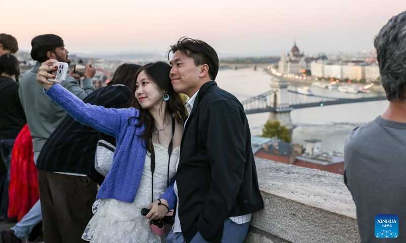 Chinese tourists take selfies at Castle Hill in Budapest, Hungary, Oct. 5, 2026. Photo: Xinhua