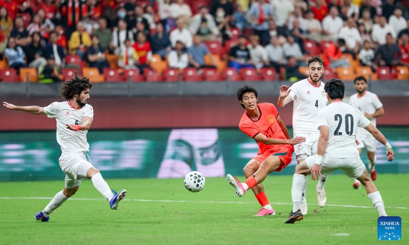 Zhao Songyuan (4th R) of China shoots during the CFA Team China International Football Competitions Chongqing 2026 between China and Tajikistan in Chongqing, Oct. 6, 2026. Photo: Xinhua