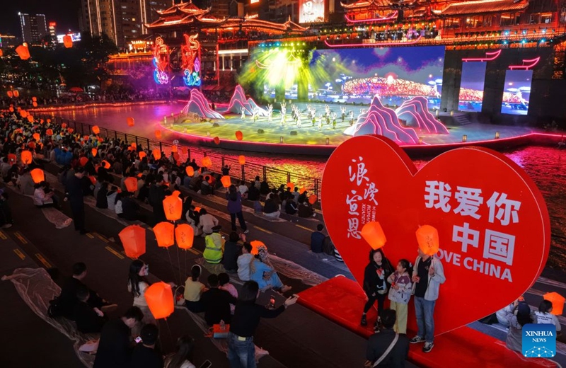 A drone photo taken on Oct. 3, 2026 shows people watching a performance in Xuan'en County in Enshi Tujia and Miao Autonomous Prefecture in central China's Hubei Province. During the National Day holiday, night tours were launched across China to create diversified consumption scenes. Photo: Xinhua