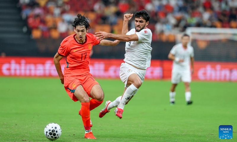 Buniyaming Abudushalamu (L) of China vies with Tabrez Islomov of Tajikistan during the CFA Team China International Football Competitions Chongqing 2026 between China and Tajikistan in Chongqing, Oct. 6, 2026. Photo: Xinhua