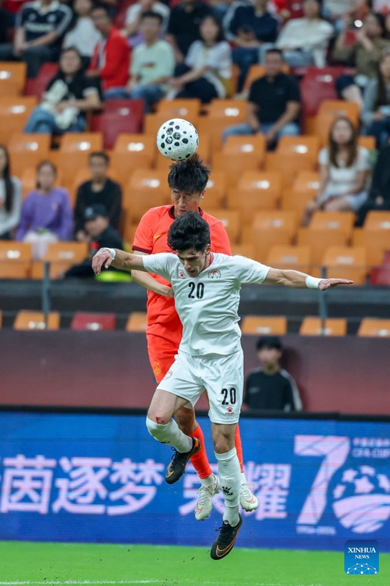 Liu Yang (top) of China and Alijon Karomatullozoda of Tajikistan head for the ball during the CFA Team China International Football Competitions Chongqing 2026 between China and Tajikistan in Chongqing, Oct. 6, 2026. Photo: Xinhua