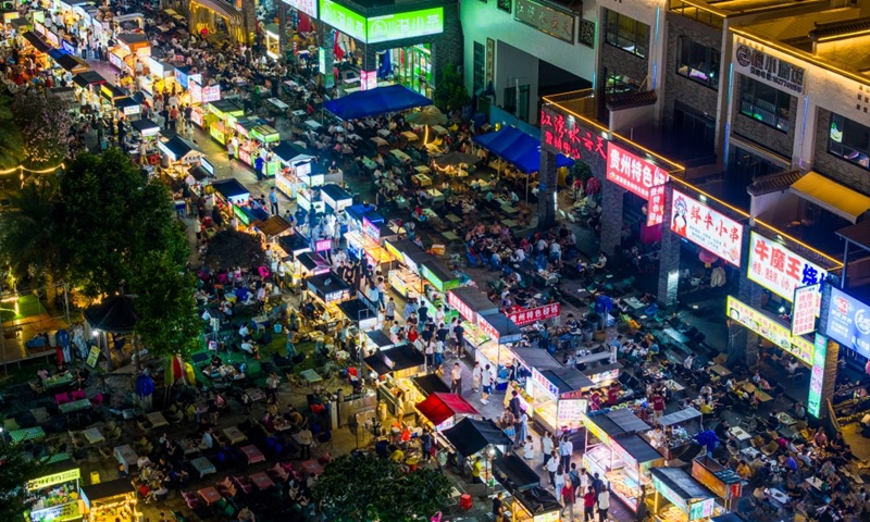 An aerial drone photo taken on Oct. 2, 2026 shows people visiting a night market in Wuzhou, south China's Guangxi Zhuang Autonomous Region. During the National Day holiday, night tours were launched across China to create diversified consumption scenes. Photo: Xinhua
