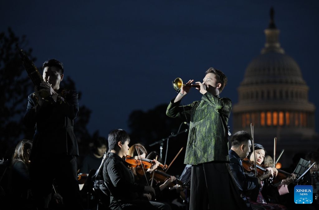 Chinese Suona performer Lin Wei (R, Front) and Sheng performer Jin Ziqi (L, Front) perform Music from Black Myth: Wukong -- Excerpt during Future Resonance -- ShanghaiEye Night in Washington, D.C., the United States, on Oct. 3, 2026. The Shanghai-themed cultural exchange event was held here on Saturday, bringing a taste of Shanghai to the United States. The event was also part of the Shanghai Let's Meet city promotion initiative and a broader series of China-U.S. people-to-people exchanges. (Xinhua/Li Rui)