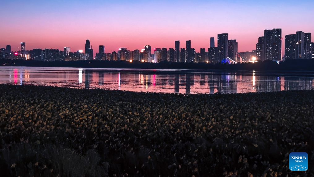 This photo taken with a mobile phone on Oct. 5, 2026 shows the East Lake at sunset in Wuhan, central China's Hubei Province. (Xinhua/Shen Hongbing)