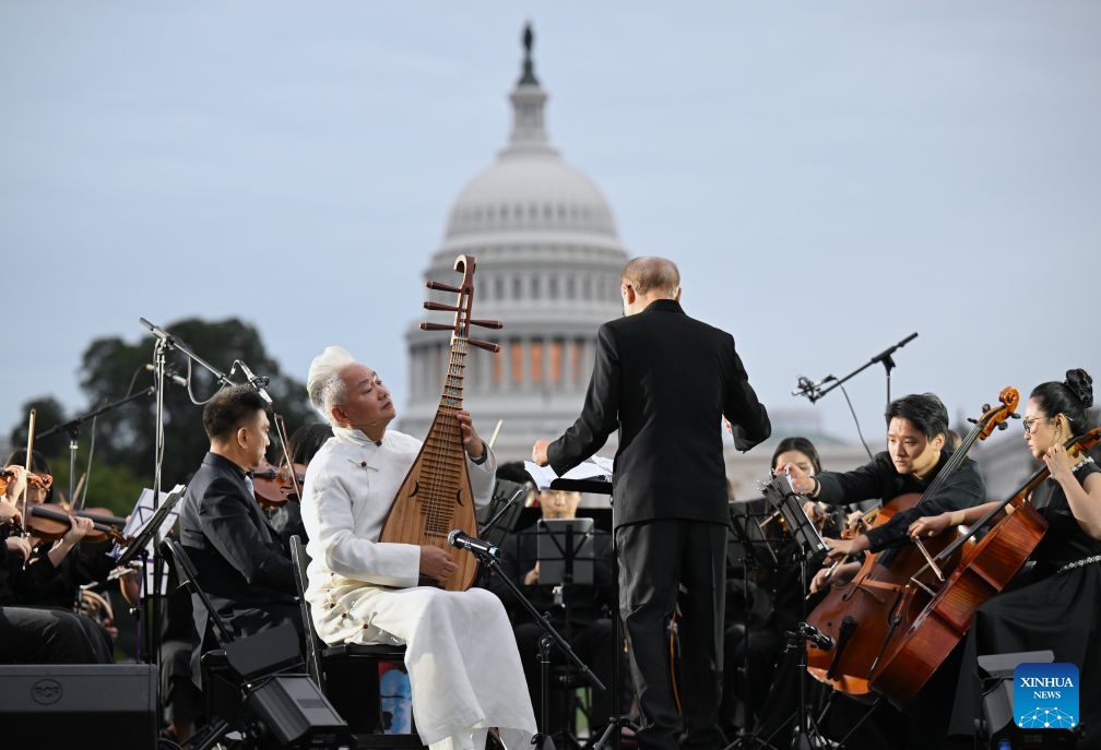 Chinese five-string pipa virtuoso Fang Jinlong performs with Manhattan Philharmonic during Future Resonance -- ShanghaiEye Night in Washington, D.C., the United States, on Oct. 3, 2026. The Shanghai-themed cultural exchange event was held here on Saturday, bringing a taste of Shanghai to the United States. The event was also part of the Shanghai Let's Meet city promotion initiative and a broader series of China-U.S. people-to-people exchanges. (Xinhua/Li Rui)