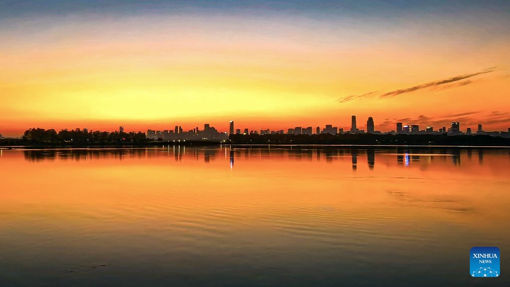 This photo taken with a mobile phone on Oct. 7, 2026 shows the East Lake at sunset in Wuhan, central China's Hubei Province. (Xinhua/Shen Hongbing)