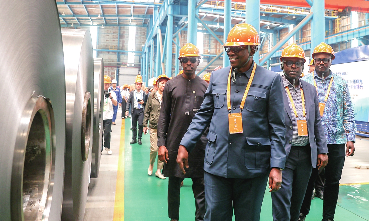 Foreign guests tour the Xinyu Iron and Steel Group's production workshop in East China's Jiangxi Province on October 8, 2026. During the tour, the group witnessed the transformation of traditional industries and booming new energy development. Photo: VCG 
