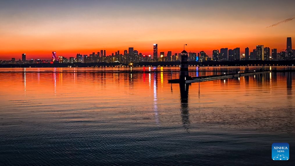 This photo taken with a mobile phone on Oct. 7, 2026 shows the East Lake at sunset in Wuhan, central China's Hubei Province. (Xinhua/Shen Hongbing)