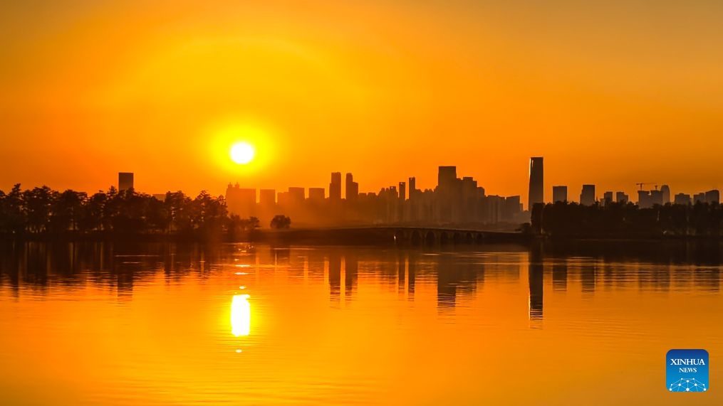 This photo taken with a mobile phone on Oct. 7, 2026 shows the East Lake at sunset in Wuhan, central China's Hubei Province. (Xinhua/Xiao Yijiu)