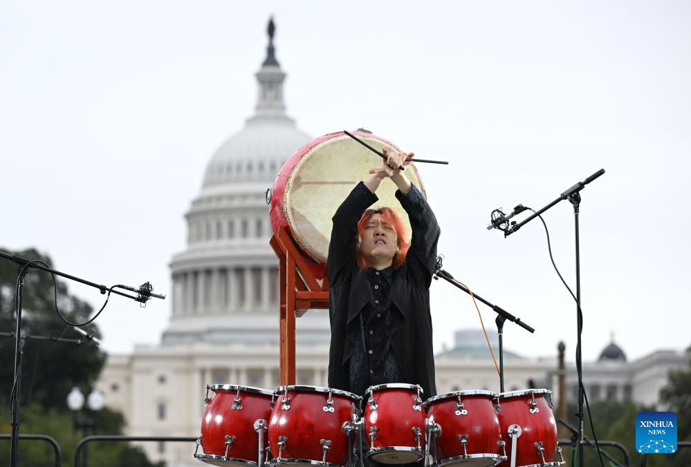 Chinese percussionist Li Zhuowen performs the Dao of Drums during Future Resonance -- ShanghaiEye Night in Washington, D.C., the United States, on Oct. 3, 2026. The Shanghai-themed cultural exchange event was held here on Saturday, bringing a taste of Shanghai to the United States. The event was also part of the Shanghai Let's Meet city promotion initiative and a broader series of China-U.S. people-to-people exchanges. (Xinhua/Li Rui)