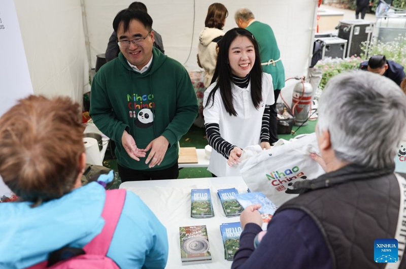 Staff members introduce Chinese tourism to visitors during the 2026 Siofok Fish Festival in Siofok, Hungary, Oct. 10, 2026. Sit on the southern shore of Lake Balaton, Hungary's largest lake, Siofok is one of the country's leading lakeside holiday destinations. The city's annual fish festival is a major autumn event, with its 13th edition taking place on Oct. 9-11, 2026. (Xinhua/Hu Zhixuan)