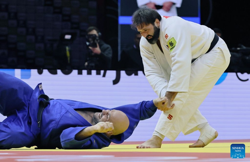 Inal Tasoev (R) of Russia fights with Ushangi Kokauri of Azerbaijan during the men's +100kg final at the 2026 World Senior Judo Championships in Baku, Azerbaijan, Oct. 10, 2026. (Xinhua/Chen Junfeng)