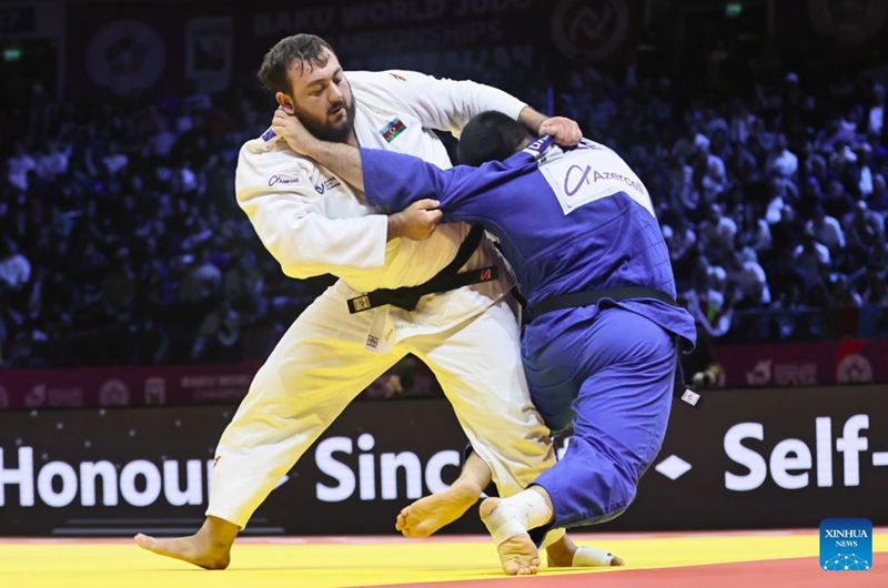 Kanan Nasibov (L) of Azerbaijan fights with Dzhamal Gamzatkhanov of Azerbaijan during the men's +100kg bronze medal match at the 2026 World Senior Judo Championships in Baku, Azerbaijan, Oct. 10, 2026. (Xinhua/Chen Junfeng)
