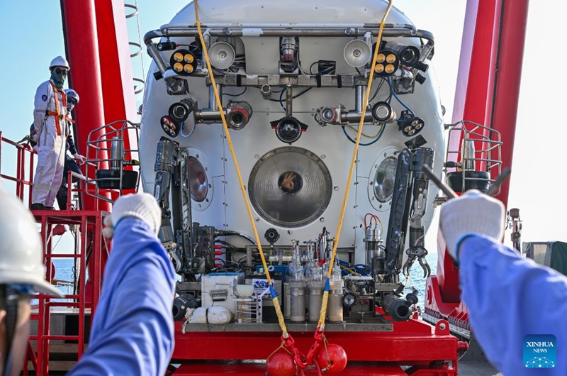 Submersible pilot Fu Wentao in cabin makes 'OK' hand gestures to members of the support team before the dive of the manned deep-sea submersible Jiaolong aboard the research vessel Deep Sea No. 1 in the western Pacific Ocean, on Oct. 10, 2026. China's research vessel Deep Sea No. 1, carrying manned deep-sea submersible Jiaolong, arrived at East Caroline Basin in the western Pacific Ocean on Saturday for deep-sea scientific research.
This marks the 466th dive of Jiaolong, with a planned diving depth of about 4,500 meters. Photo: Xinhua