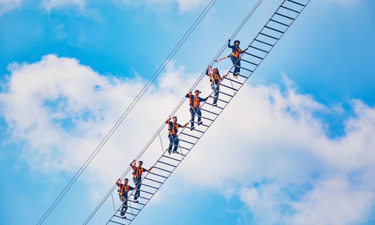Tourists climb the 