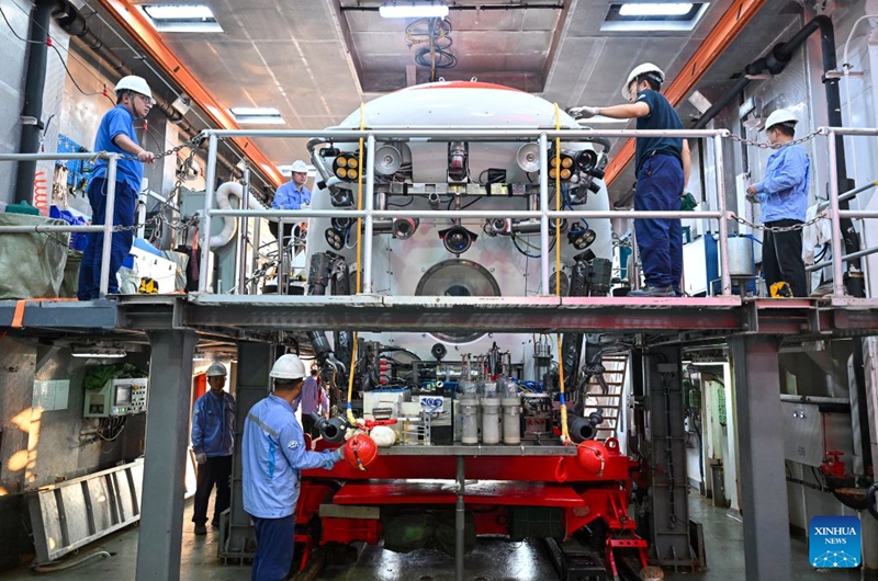 Staff members conduct pre-dive safety checks on the manned deep-sea submersible Jiaolong aboard the research vessel Deep Sea No. 1 in the western Pacific Ocean, on Oct. 10, 2026. China's research vessel Deep Sea No. 1, carrying manned deep-sea submersible Jiaolong, arrived at East Caroline Basin in the western Pacific Ocean on Saturday for deep-sea scientific research.
This marks the 466th dive of Jiaolong, with a planned diving depth of about 4,500 meters. Photo: Xinhua