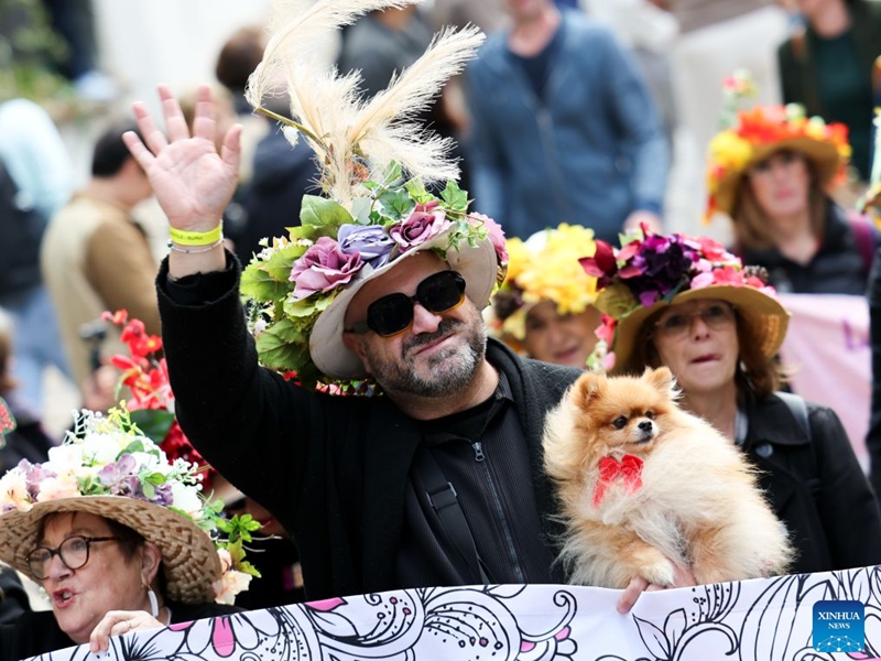 People take part in a parade during the Montmartre Grape Harvest Festival in Paris, France, Oct. 10, 2026. The 93rd edition of the Montmartre Grape Harvest Festival runs from Oct. 7 to 11, featuring a grand parade, musical performances and other festivities. (Xinhua/Wu Huiwo)