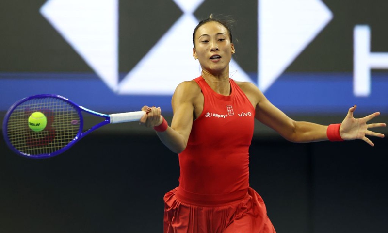 Zheng Qinwen hits a return during the women's singles semifinal between Zheng Qinwen of China and Elise Mertens of Belgium at 2026 China Open tennis tournament in Beijing, China, Oct. 10, 2026. (Xinhua/Zhang Chenlin)