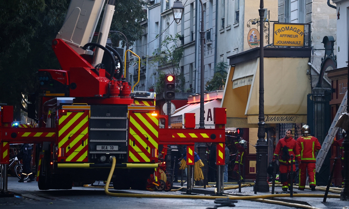 Firefighters conduct safety operations near the Marche des Enfants Rouges market in central Paris on October 12, 2026. A fire tore through Paris' oldest covered food market in ?the early hours of the day. Photo: IC