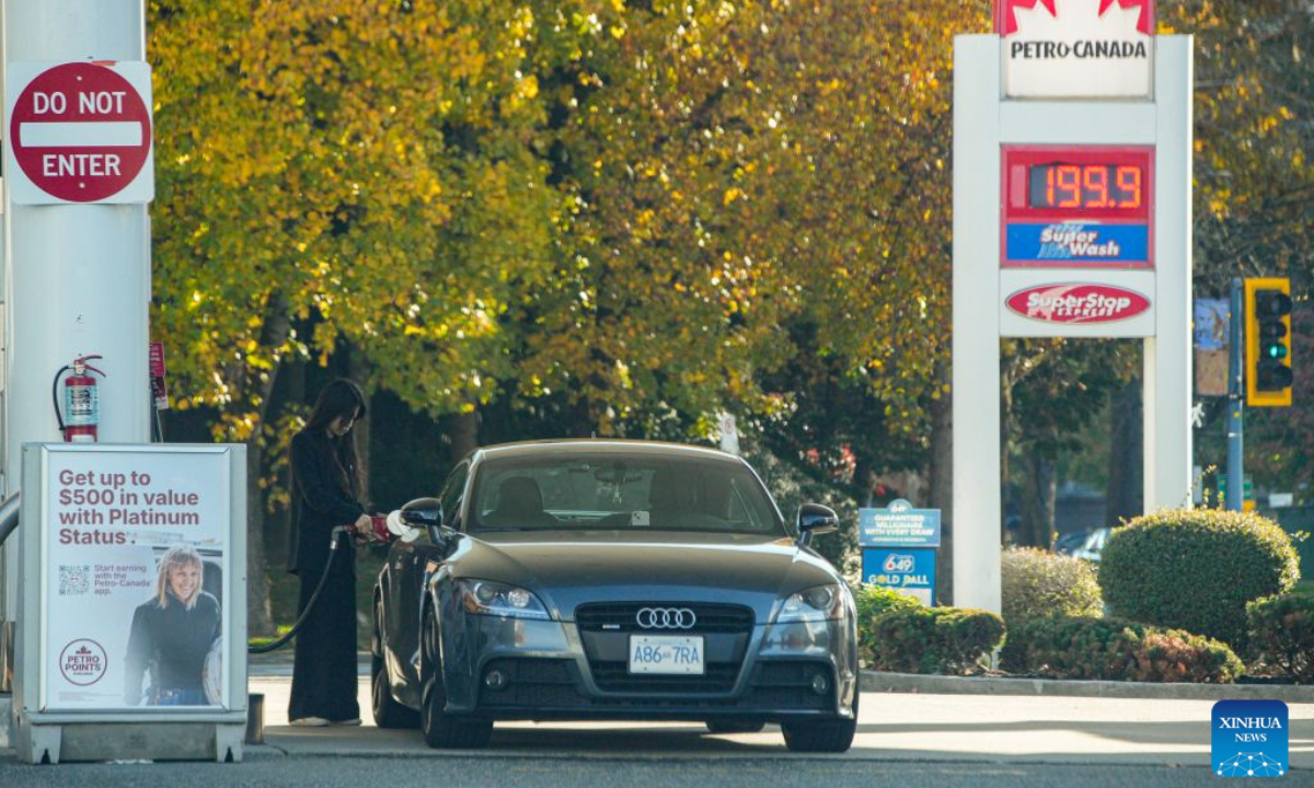 A woman fuels her car at a gas station in Vancouver, British Columbia, Canada, on Oct. 19, 2026. Canada's Consumer Price Index (CPI) rose 3.1 percent year over year in September, following a 3-percent increase in August, Statistics Canada said Monday. (Photo by Liang Sen/Xinhua)