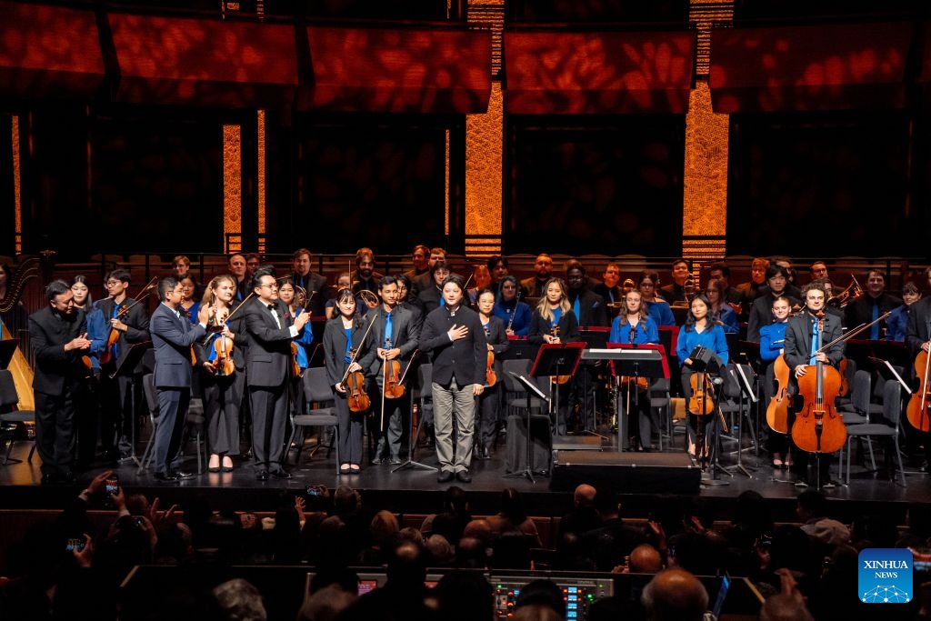 Chinese composer Li Shaosheng (C) greets to the audience after the premiere of symphonic suite Chasing the Sky, during the ninth China Now Music Festival at Lincoln Center in New York, the United States, Oct. 11, 2026. The ninth China Now Music Festival concluded Sunday at Lincoln Center in New York City with a concert showcasing the resilience and aspirations that connect the American and Chinese peoples. (Photo: Xinhua)