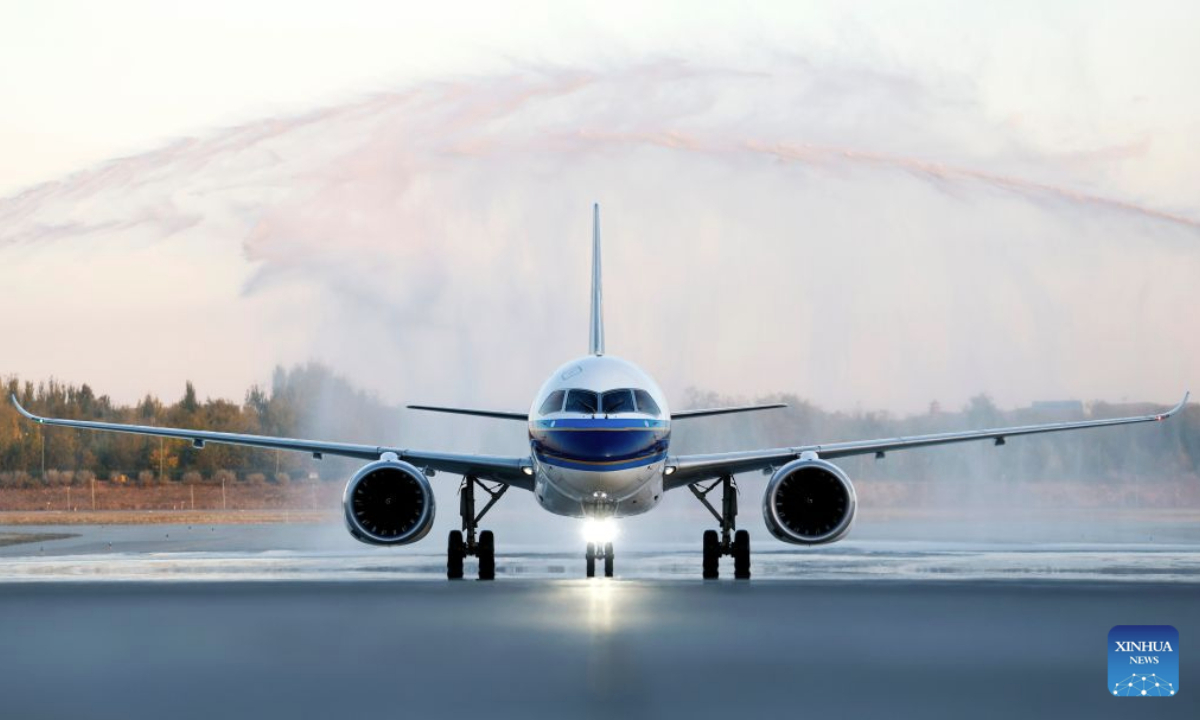 A C919 aircraft passes through a water gate at the Yinchuan Hedong International Airport in Yinchuan, northwest China's Ningxia Hui Autonomous Region, Oct. 20, 2026. China's homegrown C919 large passenger aircraft landed at the airport at 5:57 p.m. on Tuesday after departing from Changsha in central China's Hunan Province, marking the aircraft's first commercial passenger flight to Yinchuan. (Xinhua/Wang Peng)